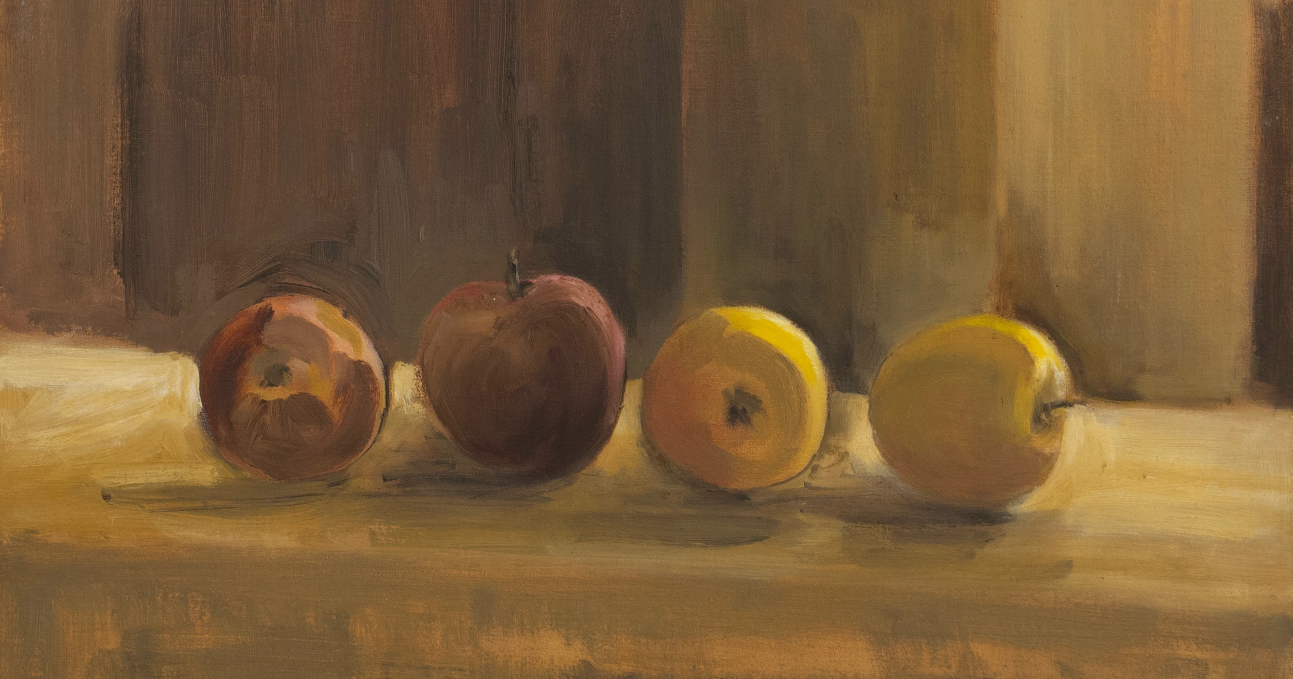 Still life of red and yellow apples against a brown background